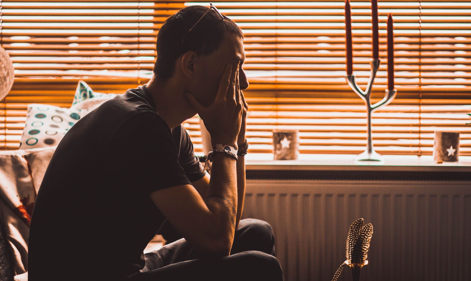 a man sitting in front of a window